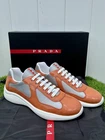 Prada America Cup Sneakers Orange Pat. Leather Silver Tech. Fabric UK11.5 New. Price: $550.00.