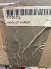 ***nos Kawasaki TX750-052 Headlight Guards (active #) New. Price: $150.95.